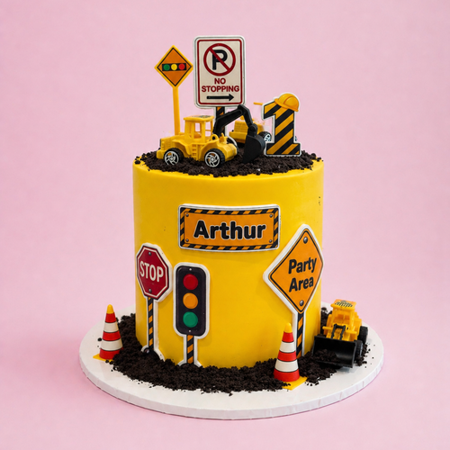 Construction themed birthday cake by Sugar Rush Bakery Perth with diggers, trucks and construction-inspired decorations.