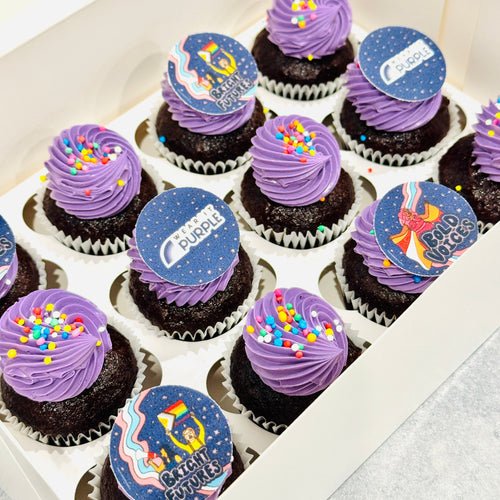 Box of Wear it Purple Mini Cupcakes with purple frosting