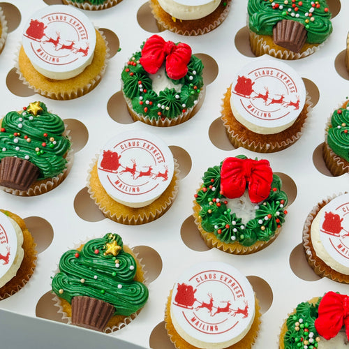 Assorted Christmas-themed cupcakes on a tray